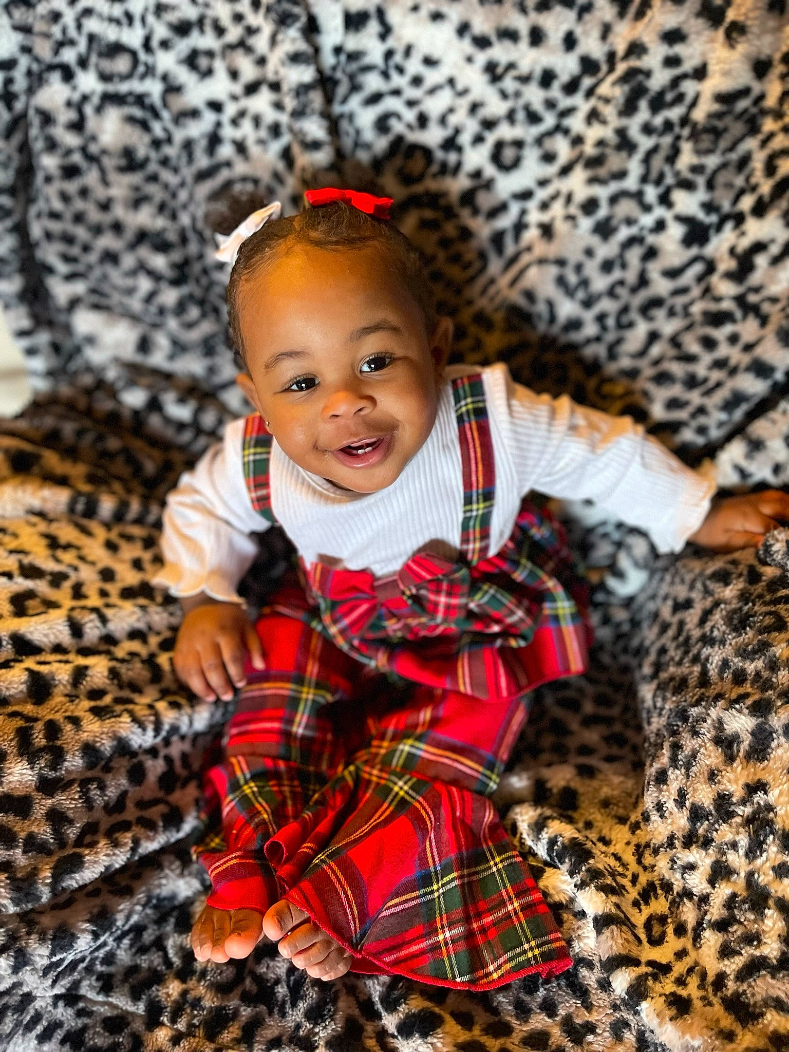 Serenity is registered to the contest to win money with this photo: baby, baby_toddler_clothing, child, facial_expression, fawn, fun, happy, head, joy, outerwear, pattern, person, plaid, sitting, skin, sleeve, smile, tartan, textile, toddler