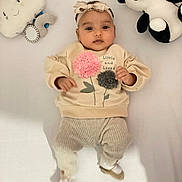 Alyana is registered to the contest to win money with this photo: baby, infant, headband, plush_toy, panda, cloud_toy, beige_clothing, flower_decoration, lying_down, white_background, cute, child, soft_toys, smiling_toy, cozy, adorable, young_child, infant_clothes, playtime, indoor