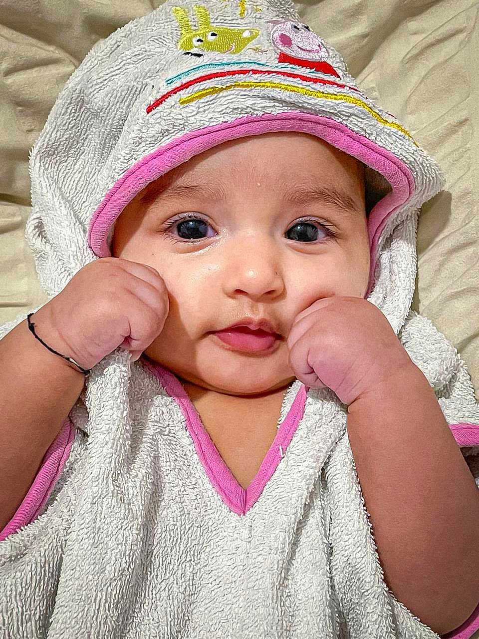 Alyana joined the competition — help win amazing prizes! baby, infant, towel, hood, cute, face, portrait, child, skin, hand, gesture, pink, white, fabric, soft, closeup, eyes, expression, indoor, background