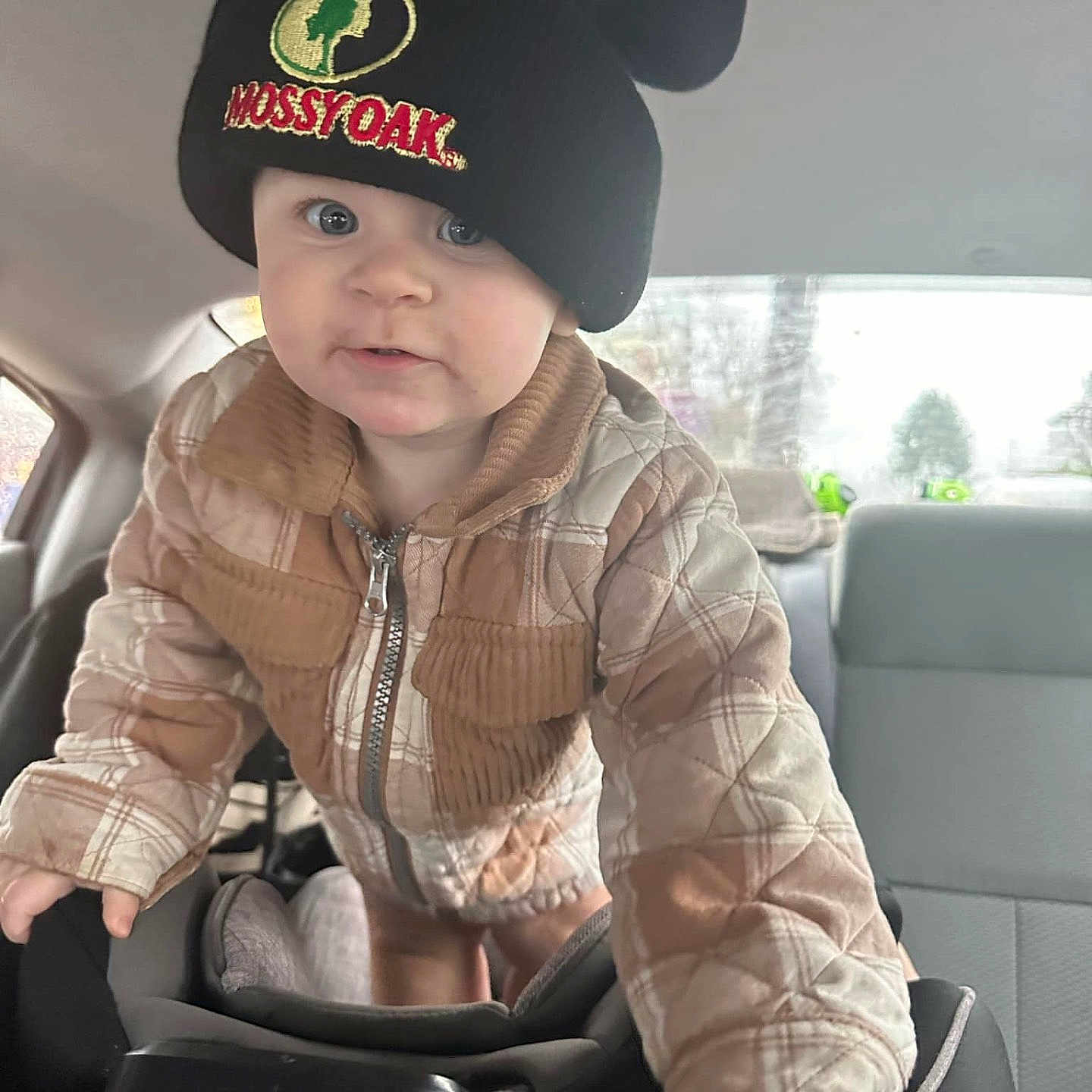 Isabella Mays is registered to the contest to win money with this photo: baby, baseballcap, cap, car, clothing, cushion, face, happy, hat, head, homedecor, person, photography, portrait, sitting, sleeve, smile, tape, transportation, vehicle