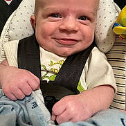 Zayden is registered to the contest to win money with this photo: accessories, baby, belt, bodypart, clothing, cushion, face, finger, gun, hand, happy, head, homedecor, newborn, pants, person, photography, portrait, smile, weapon