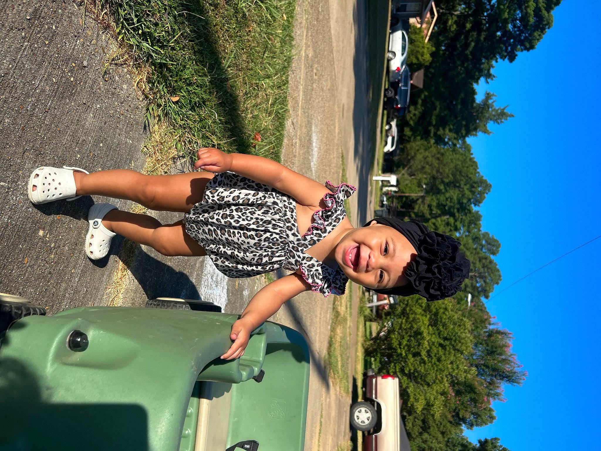 Kaelynn joined the competition — help win amazing prizes! automotive_design, automotive_lighting, automotive_tire, blue, car, fender, fun, green, hand, headwear, hood, leisure, motor_vehicle, person, plant, rolling, sky, thigh, tire, tree