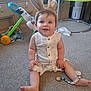 baby, bunny_ears, carpet, child, colorful, cute, floor, furniture, happy, headband, indoor, infant, pacifier, playtime, romper, room, sitting, smile, toy, young_child