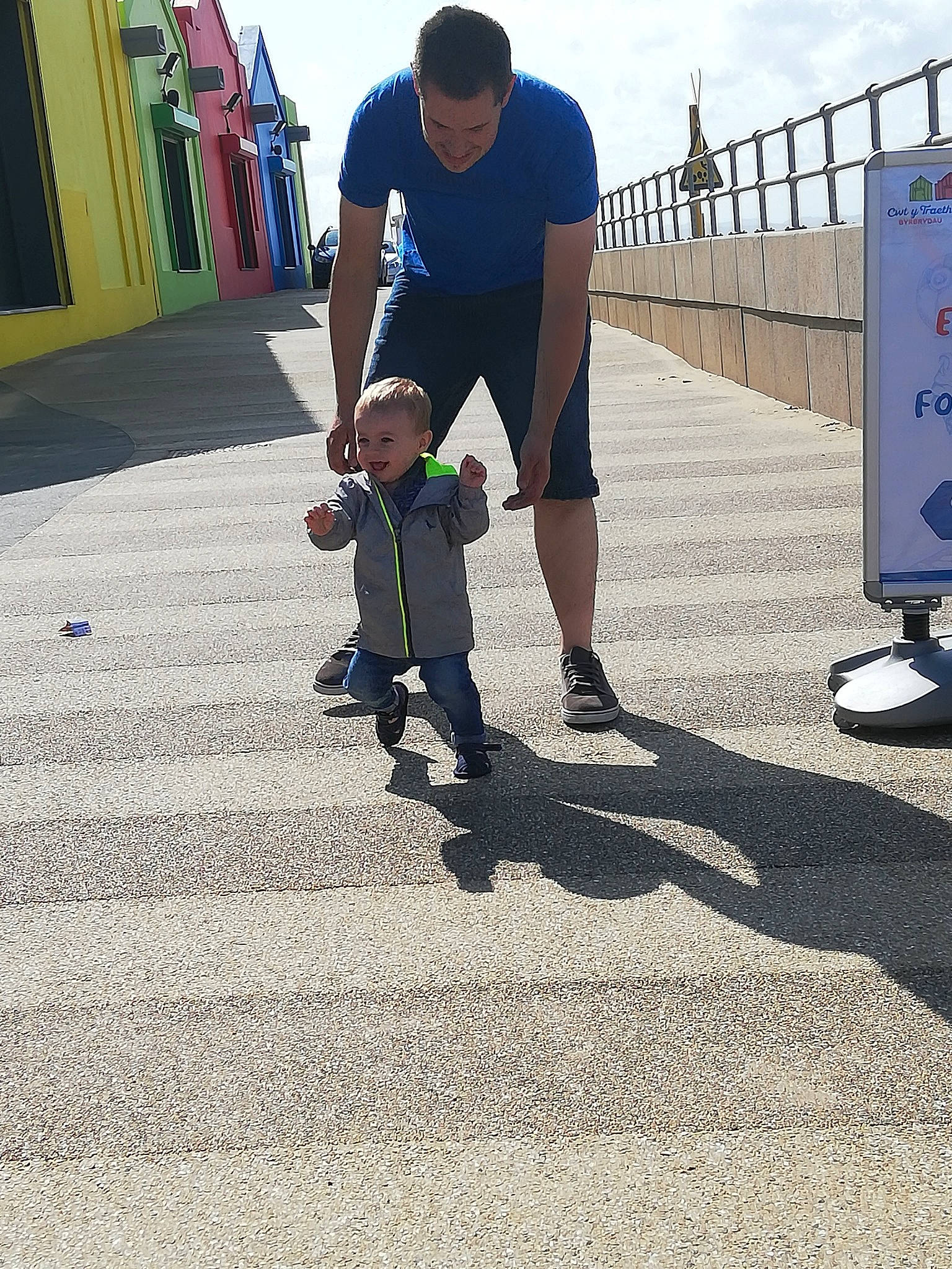 Jackson is registered to the contest to win money with this photo: asphalt, child, concrete, footwear, fun, games, person, play, recreation, road, shadow, shoe