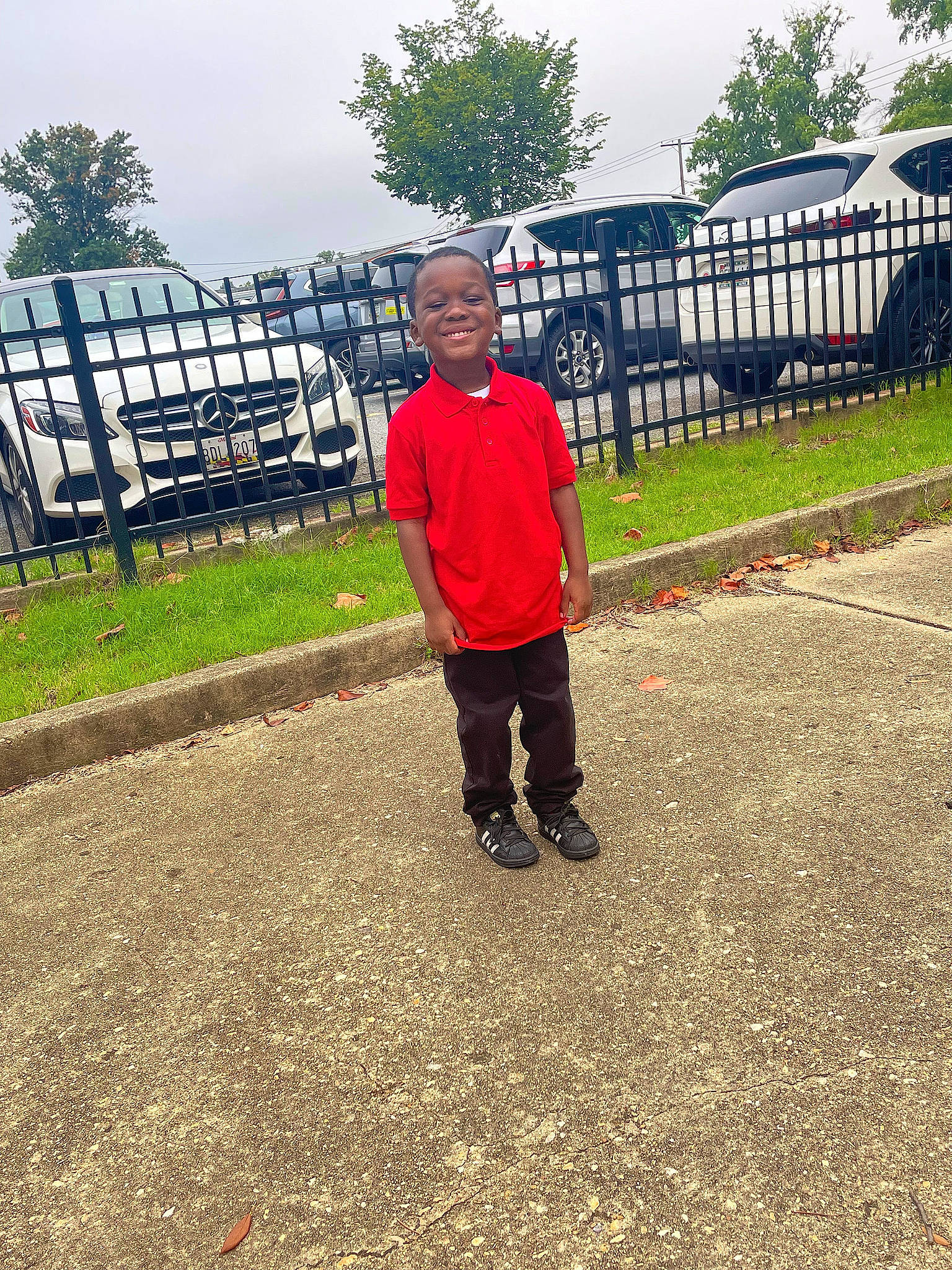 Malachi joined the competition — help win amazing prizes! asphalt, automotive_tire, city, fence, grass, joy, landscape, leisure, person, plant, recreation, road, road_surface, rolling, sidewalk, sky, t_shirt, tints_and_shades, tire, tree