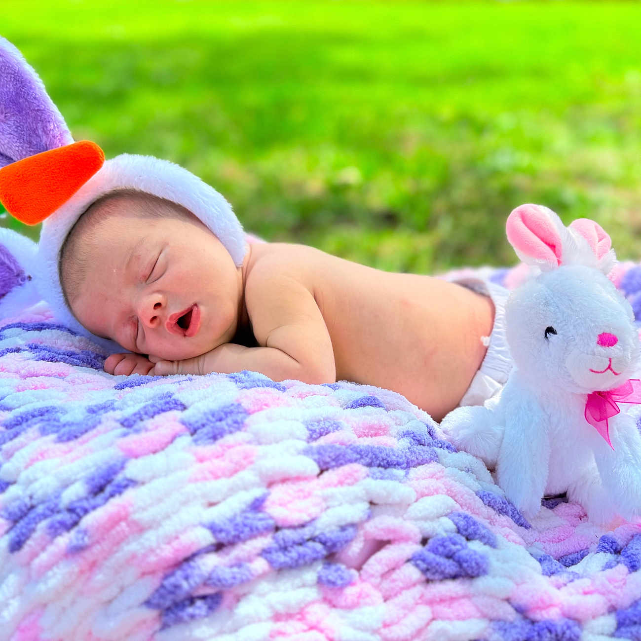 Melissa joined the competition — help win amazing prizes! baby, blanket, clothing, face, furniture, glove, grass, head, nature, newborn, person, photography, plant, plush, portrait, purple, quilt, sleeping, towel, toy