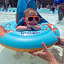 Axl joined the competition — help win amazing prizes! baby, blue, child, daytime, float, fun, hands, inflatable, orange, outdoor, people, pool, relaxing, safety, summer, sunglasses, sunny, swimming, tiger, water