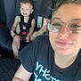 Charlie joined the competition — help win amazing prizes! adult, car_interior, car_seat, child, face, glasses, hair, highway, person, road, safety, seatbelt, selfie, shirt, smile, sunlight, tattoo, toddler, vehicle, window