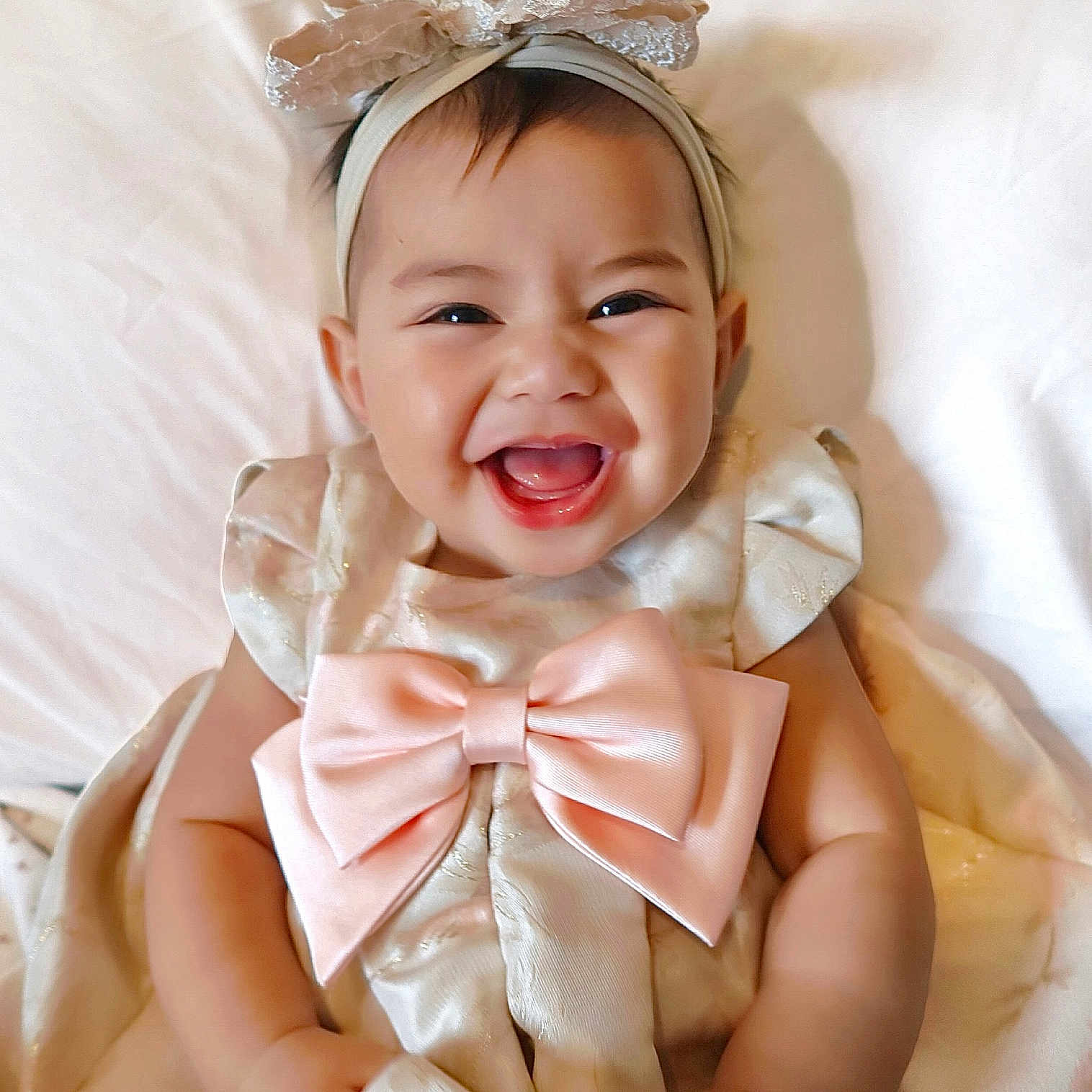 Alia joined the competition — help win amazing prizes! accessories, baby, babylaughing, bonnet, bowtie, clothing, dress, face, formalwear, happy, hat, head, headband, jewelry, laughing, person, photography, portrait, smile, tie