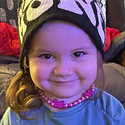 Jillian joined the competition — help win amazing prizes! beaded_necklace, butterfly, casual, child, childhood, clothing, cozy, cute, face, fashion, happy, hat, headwear, indoor, long_hair, person, portrait, smile, warm_lighting, young