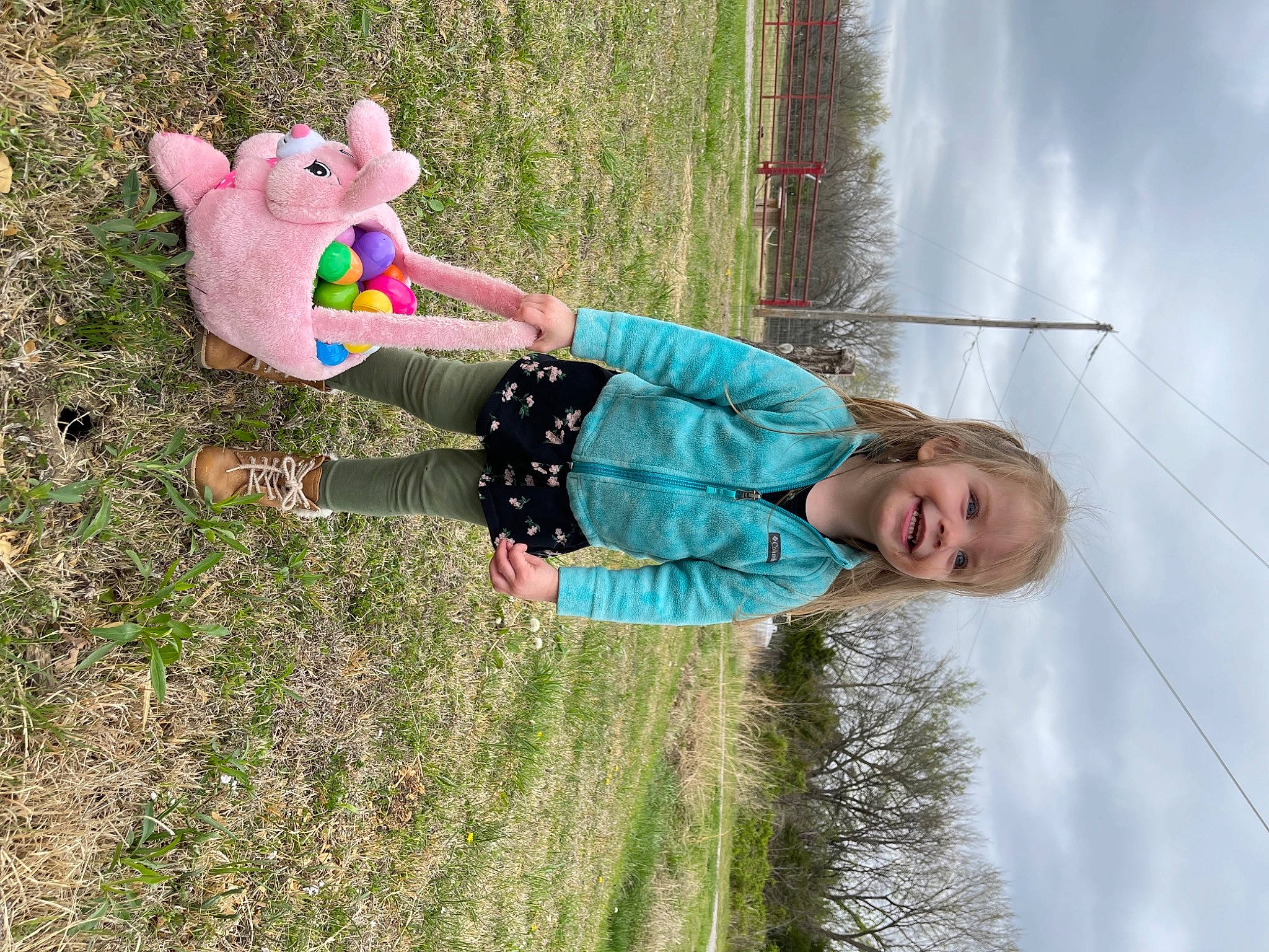 Everleigh joined the competition — help win amazing prizes! arm, child, cloud, facial_expression, fun, grass, grassland, hand, happy, joy, leisure, people_in_nature, person, plant, recreation, sky, smile, t_shirt, toddler, toy