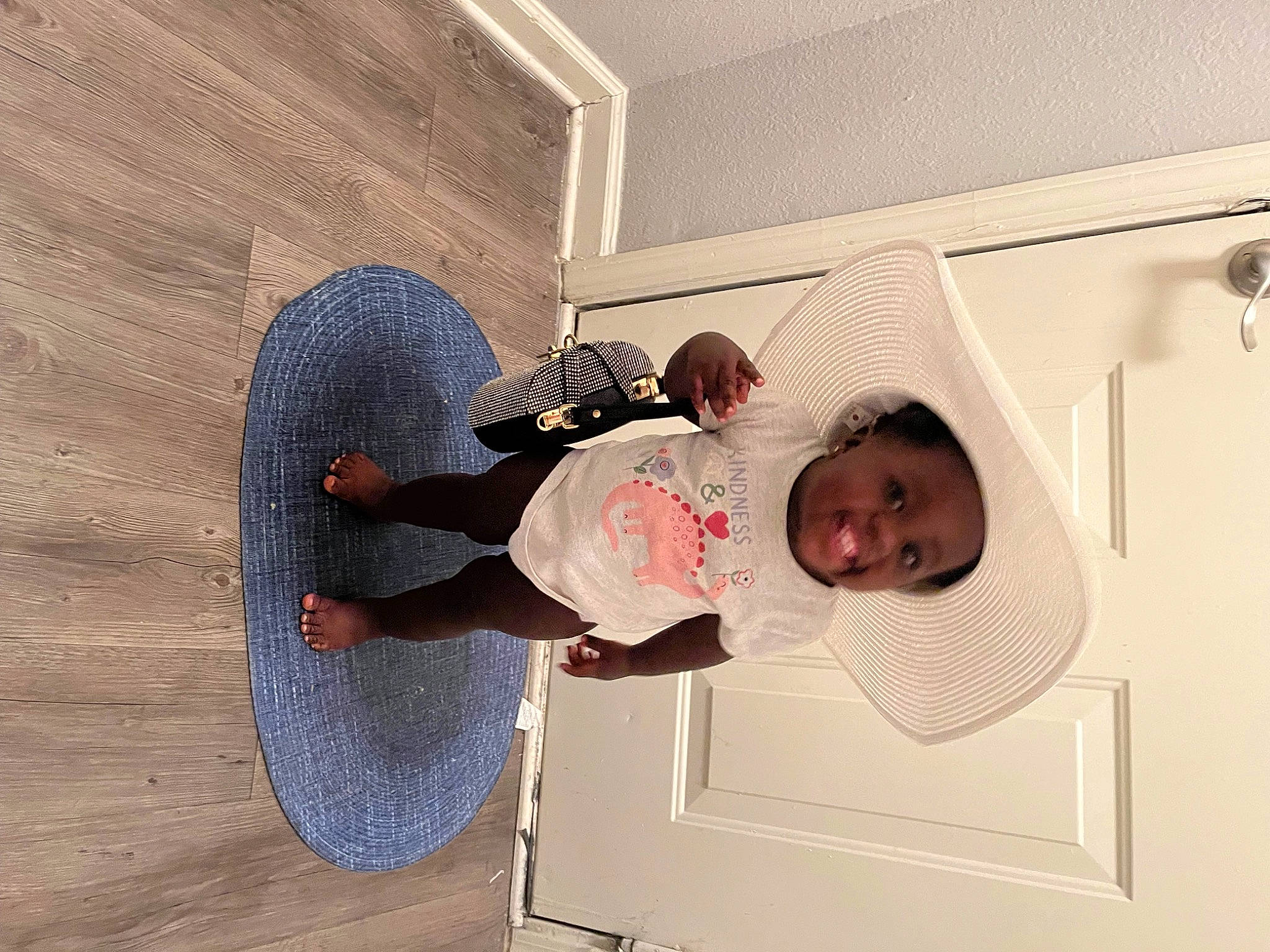 Nova joined the competition — help win amazing prizes! baby, baby_toddler_clothing, ceiling, child, cleanliness, comfort, elbow, flooring, fun, hardwood, hat, person, room, sleeve, t_shirt, toddler, walking_shoe, wood