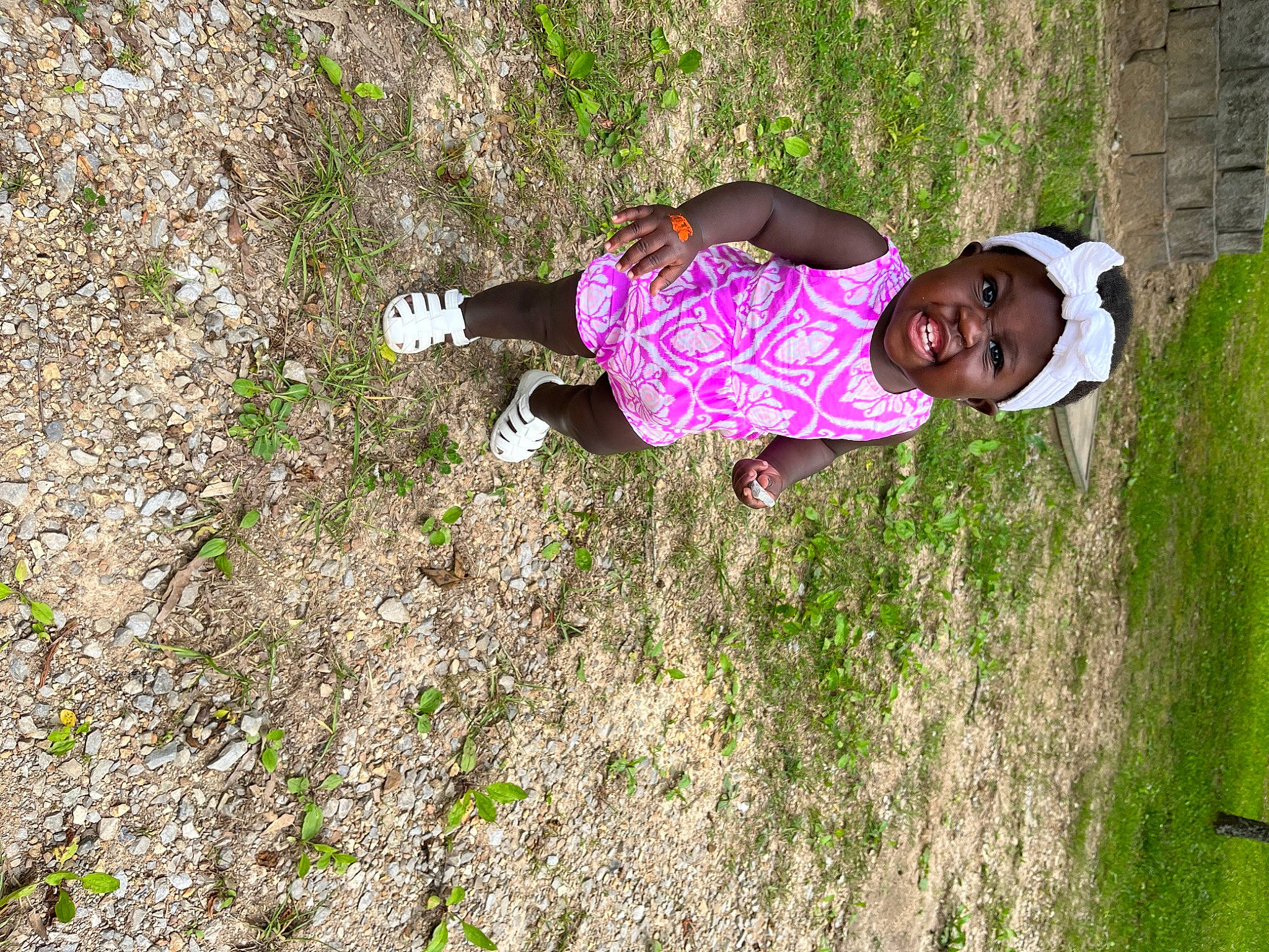 Nova is registered to the contest to win money with this photo: baby, baby_toddler_clothing, child, fun, grass, grassland, groundcover, happy, headwear, landscape, leisure, magenta, pasture, people_in_nature, person, plant, prairie, recreation, soil, terrestrial_plant