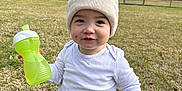 Kendrick joined the competition — help win amazing prizes! baby, babylaughing, backyard, baseballcap, beanie, blackhair, bottle, cap, clothing, crawling, face, field, footwear, grass, grassland, hair, happy, hat, head, herbal