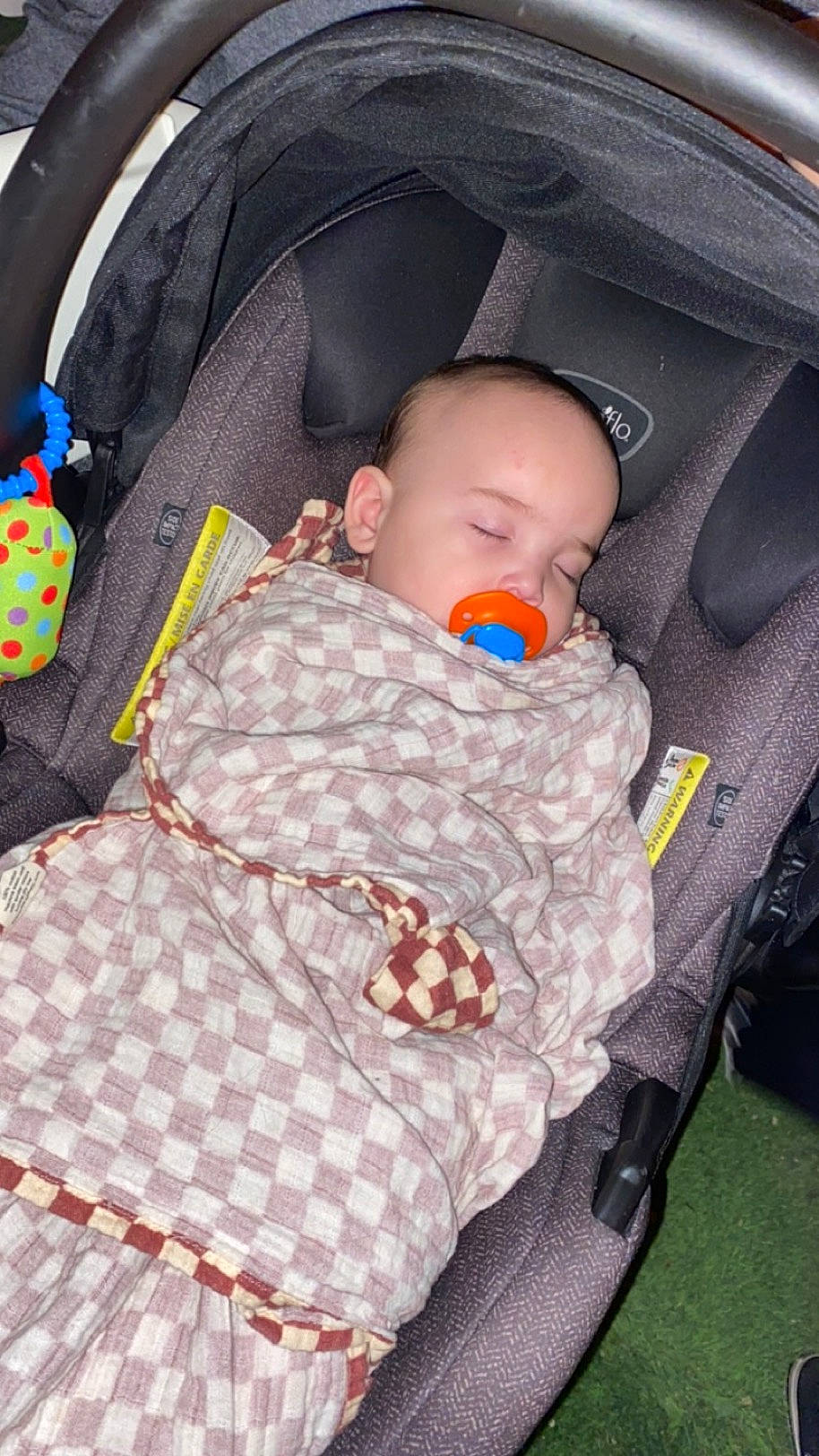 Kendrick is registered to the contest to win money with this photo: auto_part, baby, baby_carriage, baby_products, baby_safety, baby_sleeping, baby_toddler_clothing, bag, car_seat, car_seat_cover, child, comfort, infant_bed, linens, luggage_and_bags, pattern, person, sitting, textile, toddler