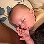 baby, sleeping, thumb_sucking, blanket, cozy, infant, child, resting, face, hand, closeup, indoors, cute, soft_lighting, peaceful, comfort, youth, portrait, skin, sleep