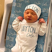 Layton joined the competition — help win amazing prizes! newborn, baby, hospital, bassinet, layton_cole, clothing, hat, blanket, sleeping, infant, cute, child, person, bed, maternity, hospital_room, baby_clothes, swaddled, resting, fresh