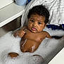 baby, bath, bubbles, foam, towel, water, skin, child, cute, indoor, portrait, person, relaxing, bathtub, wet, curly_hair, infant, young, clean, bath_time