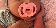 Soliana is registered to the contest to win money with this photo: baby, infant, pacifier, headband, bow, blanket, pink, gray, cute, hands, face, clothing, sleepwear, soft, newborn, portrait, closeup, skin, resting, lying