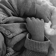 Isaiah participe au concours pour gagner de l'argent avec cette photo : baby, hands, sweater, knitwear, blanket, cozy, sleeping, infant, closeup, black_and_white, texture, soft, warm, cuffed_sleeves, fabric, newborn, comfort, rest, child, portrait