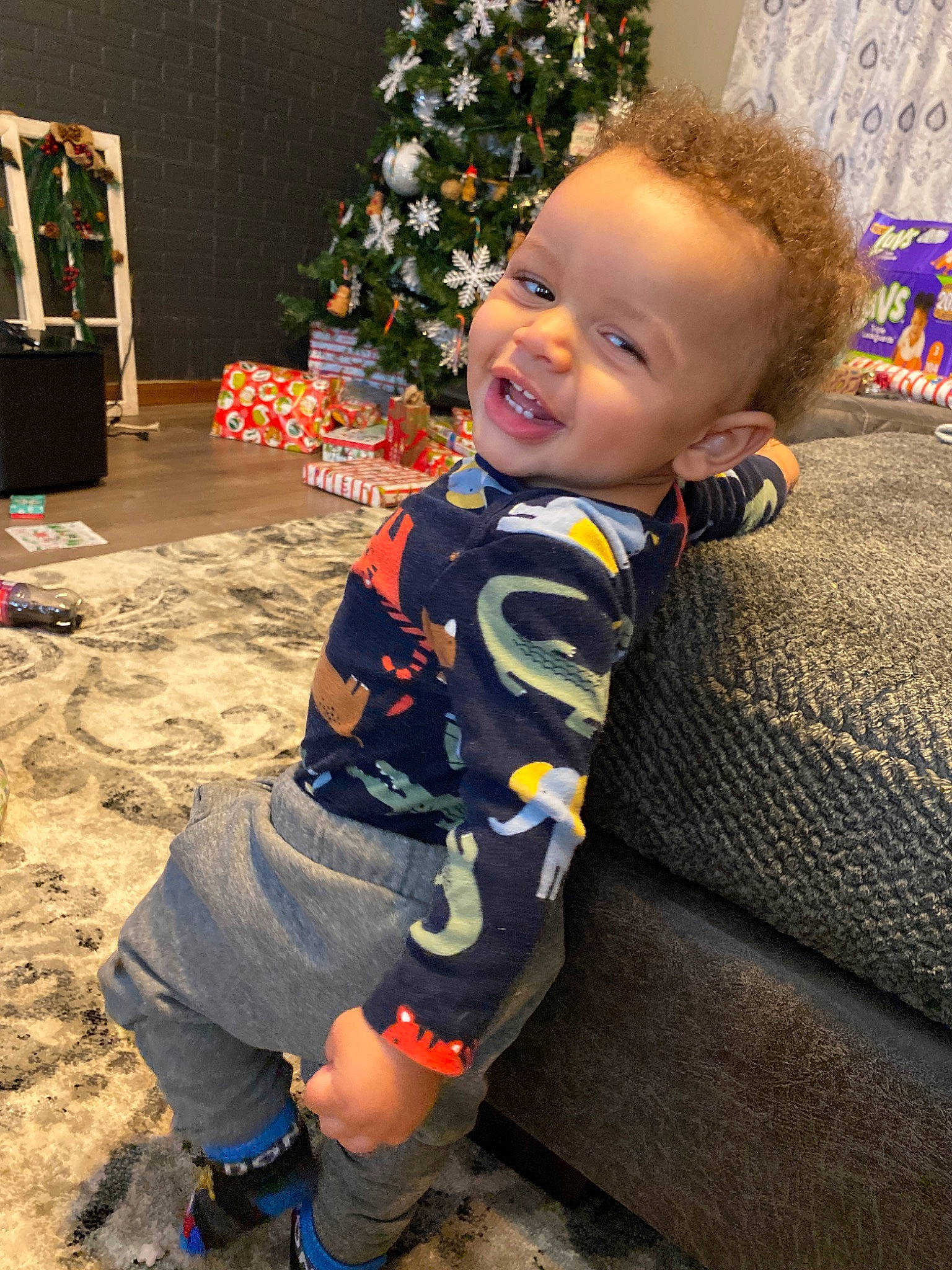 Samari is registered to the contest to win money with this photo: active_shorts, baby, baby_toddler_clothing, bermuda_shorts, child, christmas, christmas_decoration, christmas_eve, christmas_lights, christmas_ornament, christmas_tree, holiday, holiday_ornament, laugh, ornament, person, play, shorts, sock, toddler