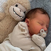 Lilah joined the competition — help win amazing prizes! baby, newborn, sleeping, pacifier, plush_toy, stuffed_animal, monkey, blanket, soft_toy, infant, cozy, cute, child, bed, sleep, clothing, fabric, rest, comfort, portrait