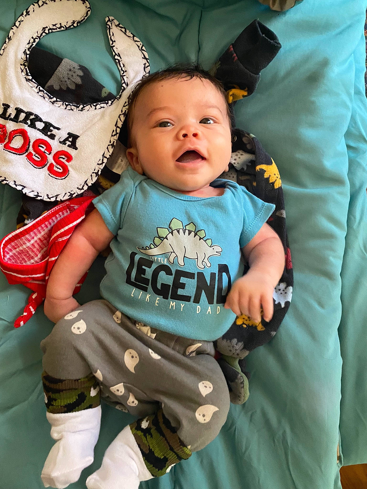 Legend is registered to the contest to win money with this photo: baby, baby_products, baby_toddler_clothing, child, clothing, comfort, cool, event, green, happy, hat, person, personal_protective_equipment, product, sitting, sleeve, smile, t_shirt, textile, toddler