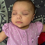 Chloe is registered to the contest to win money with this photo: baby, sleeping, infant, purple_clothing, polka_dot, cute, peaceful, face, child, portrait, soft_lighting, blanket, pattern, small_baby, relaxation, toddler, sleep, indoors, young_child, smiling