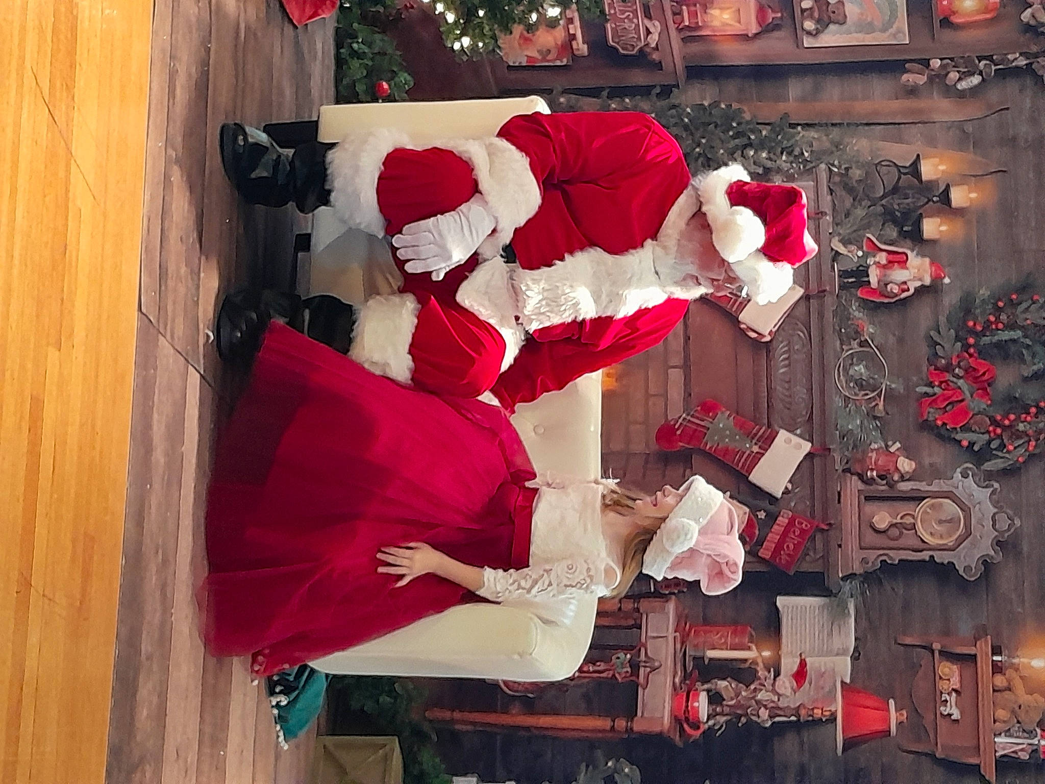 Marcella is registered to the contest to win money with this photo: carmine, christmas, christmas_decoration, christmas_eve, christmas_lights, christmas_ornament, event, fictional_character, headwear, holiday, holiday_ornament, interior_design, lap, ornament, person, red, room, santa_claus, tradition, tree