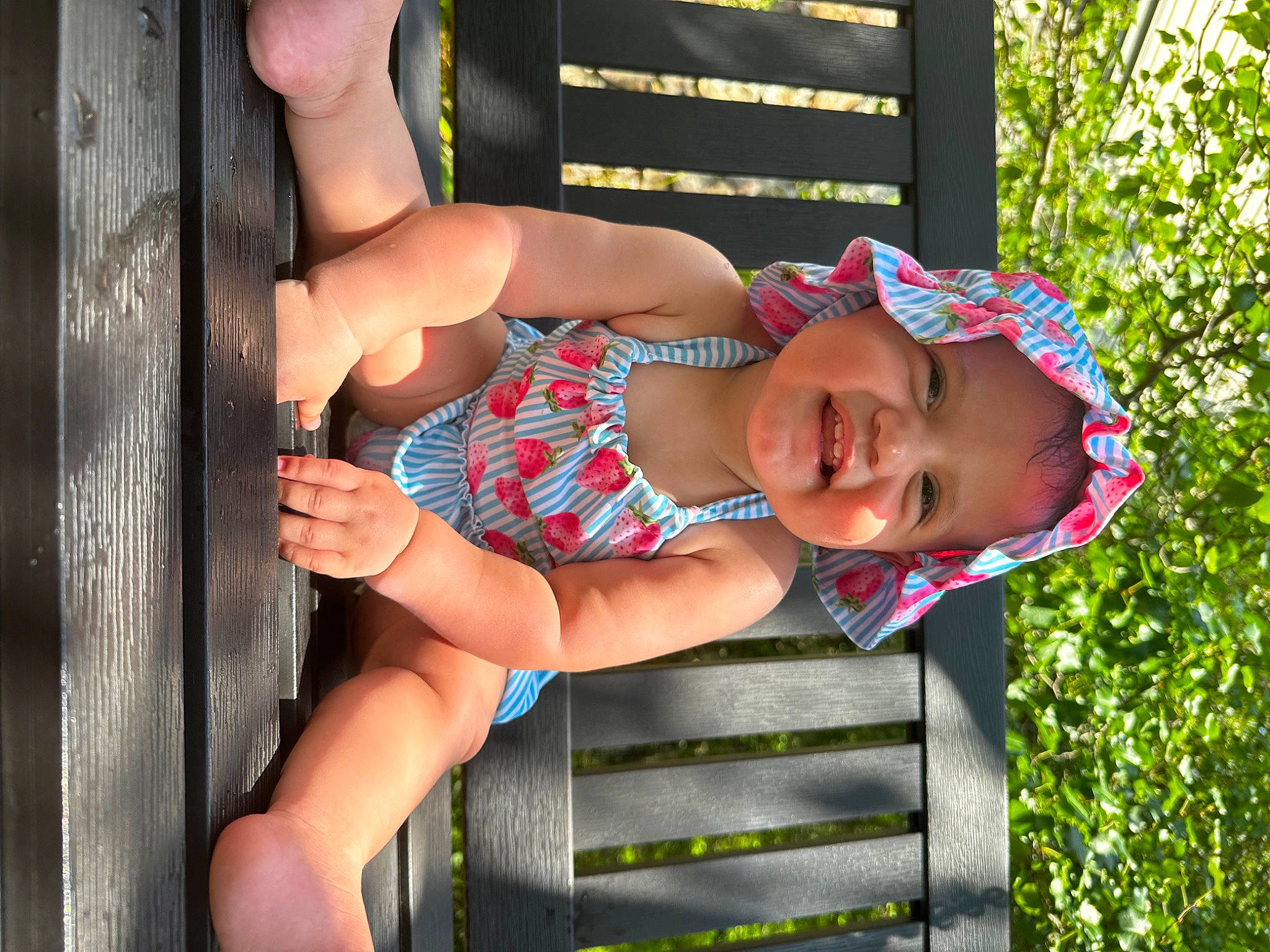 Sofia is registered to the contest to win money with this photo: baby, baby_toddler_clothing, child, eyewear, finger, fun, glasses, grass, happy, hat, headwear, joy, leisure, people_in_nature, person, plant, product, shorts, smile, thigh