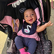 Destinee joined the competition — help win amazing prizes! baby, car_seat, smiling, bib, pink_socks, outdoor, sunlight, clothing, happy, person, infant, seat, fabric, head, face, cute, child, casual, portrait, joy