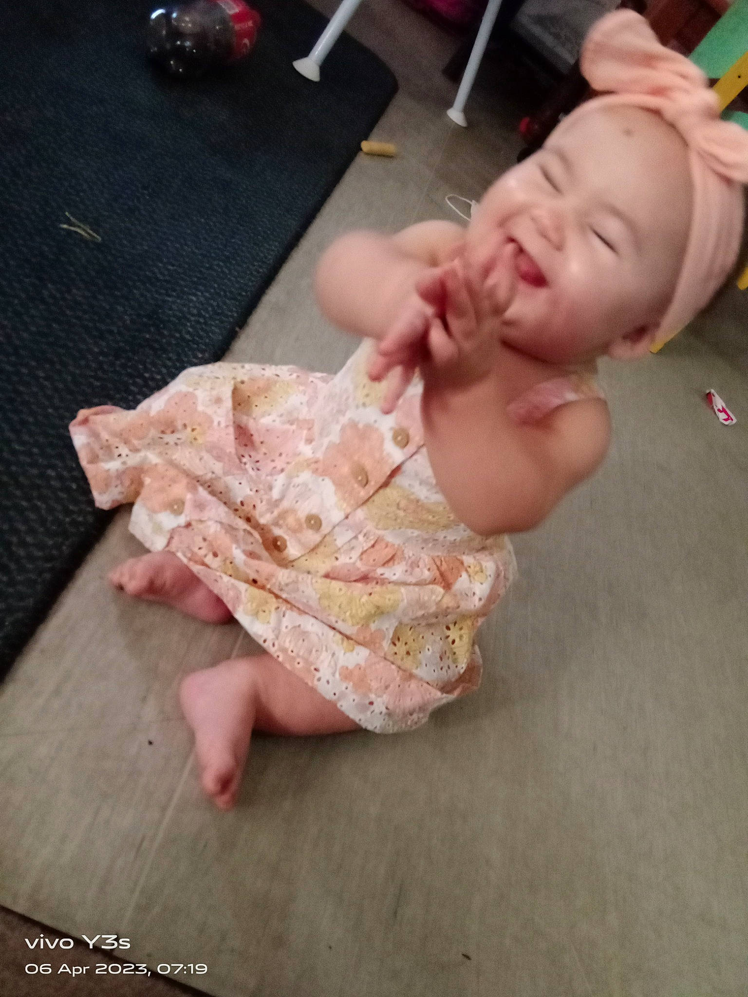 Eliza is registered to the contest to win money with this photo: baby, baby_toddler_clothing, barefoot, cheek, dress, flooring, foot, fun, gesture, hand, happy, head, human_body, human_leg, joy, nail, neck, person, pink, skin