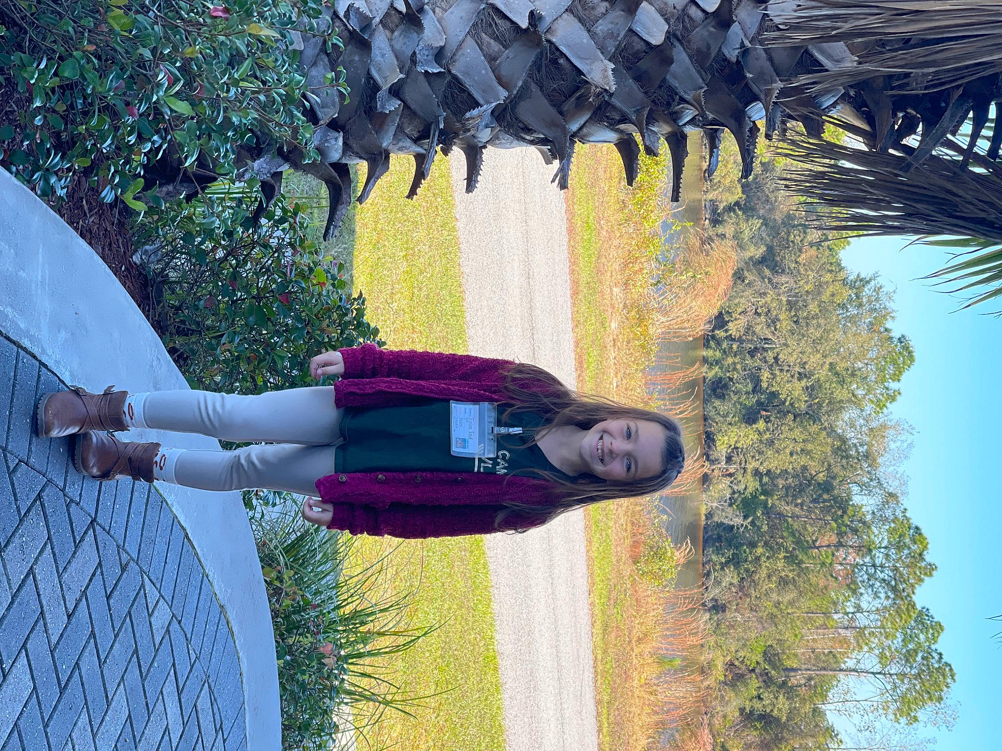 Finlee is registered to the contest to win money with this photo: arecales, electric_blue, fun, grass, happy, joy, leisure, line, magenta, palm_tree, people_in_nature, person, plant, reflection, sky, smile, tints_and_shades, travel, tree, white