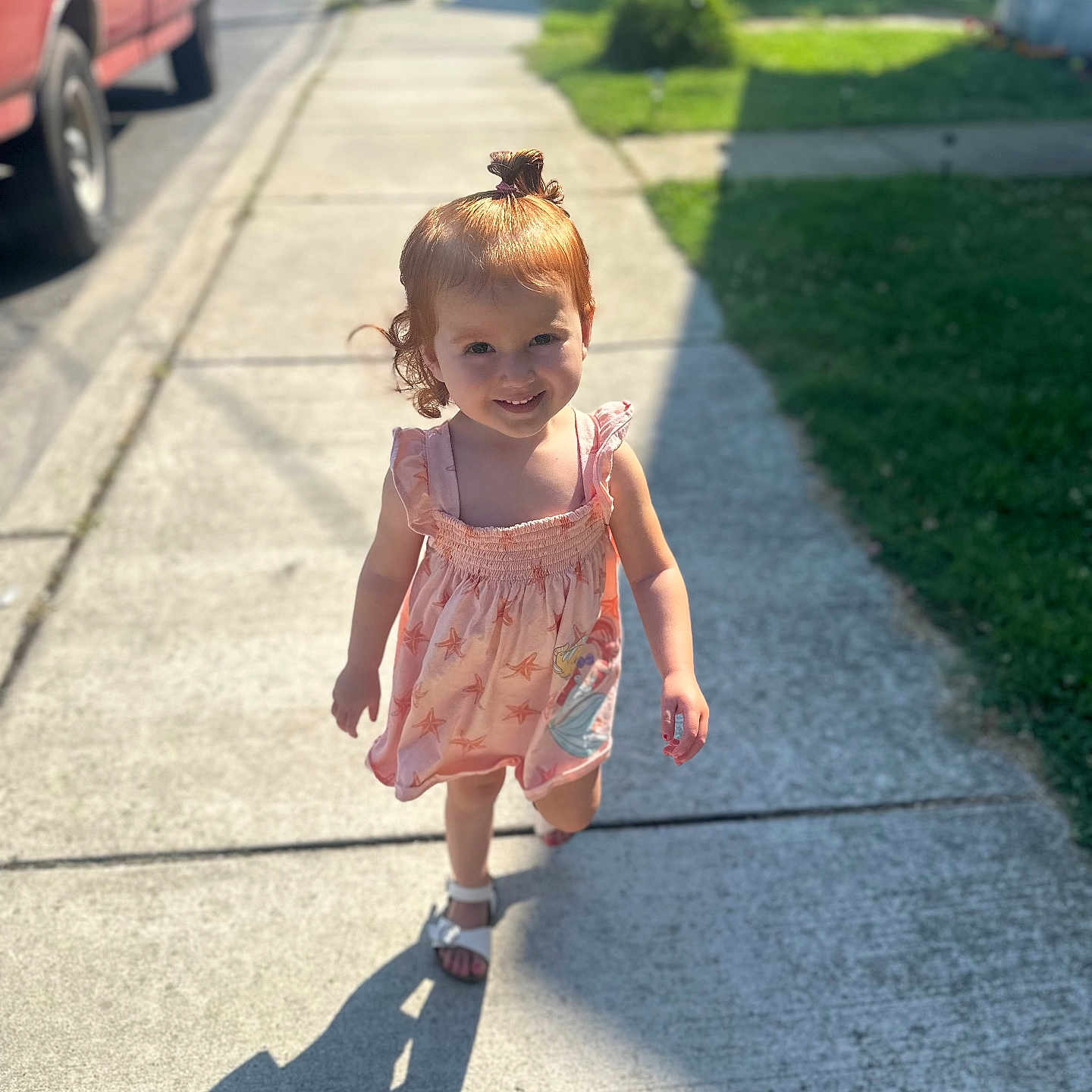 Camila joined the competition — help win amazing prizes! child, city, clothing, dress, face, female, girl, grass, head, path, person, photography, plant, portrait, road, shorts, sidewalk, street, urban, walking