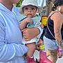 baby, child, person, hat, bib, boots, cowboy_boots, holding, hoodie, tattoos, earrings, outdoor, festival, tent, walking, curious, keychain, glasses, shorts, summer