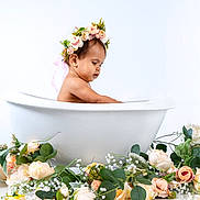 Massiel joined the competition — help win amazing prizes! baby, bathtub, child, cute, decor, floral_arrangement, flower_crown, flowers, greenery, infant, nature, peaceful, pink_flowers, portrait, side_view, skin, studio_shot, water, white_background, white_flowers