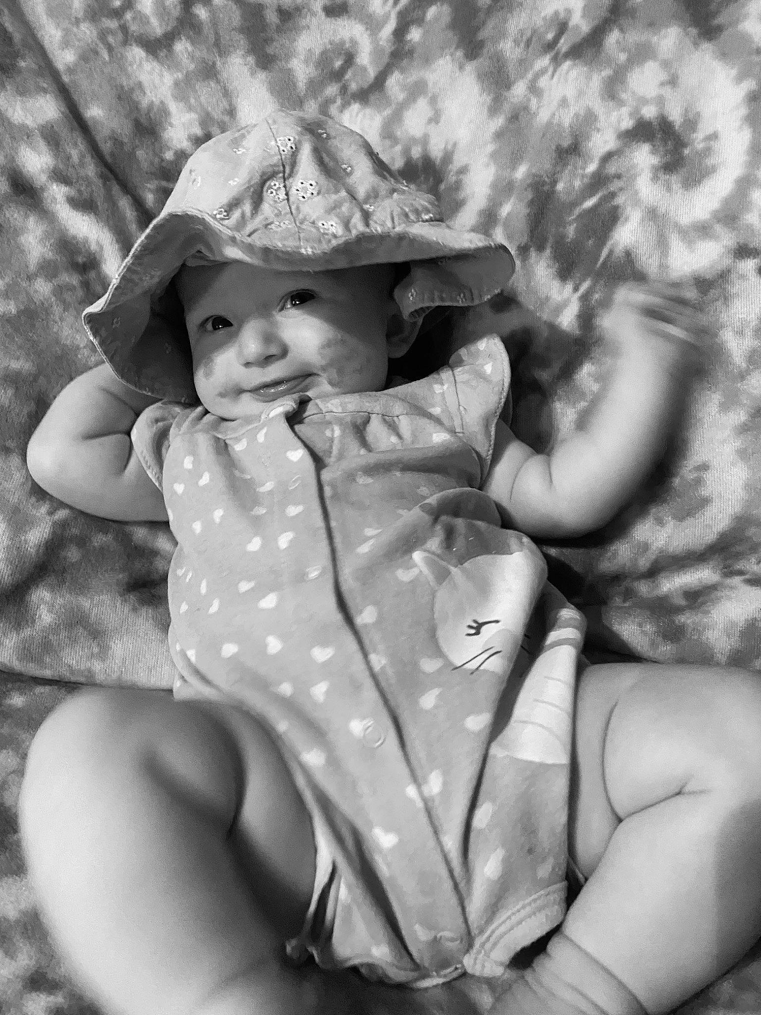 Raelynn joined the competition — help win amazing prizes! black_and_white, finger, grass, happy, hat, headgear, headwear, human_body, iris, leg, lip, organ, people_in_nature, person, photograph, skin, smile, standing, style, sun_hat