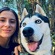 Max joined the competition — help win amazing prizes! animal, closeup, collar, daylight, dog, face, forest, friendship, happy, leash, nature, outdoor, pet, portrait, selfie, siberian_husky, smile, tongue_out, trees, woman