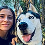 animal, closeup, collar, daylight, dog, face, forest, friendship, happy, leash, nature, outdoor, pet, portrait, selfie, siberian_husky, smile, tongue_out, trees, woman