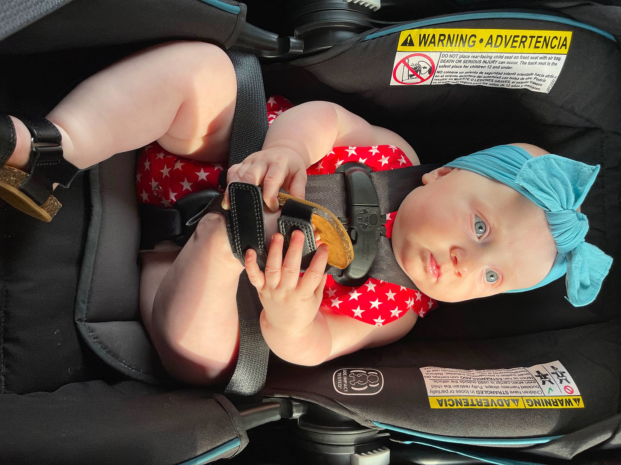 Aspyn is registered to the contest to win money with this photo: auto_part, baby, baby_carriage, baby_products, baby_toddler_clothing, car_seat, carmine, child, comfort, elbow, fun, hat, headwear, human_leg, lap, nail, pattern, person, sitting, thigh