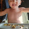 toddler, child, high_chair, smile, food, messy, indoor, baby, feeding, happy, face, human, seat, chicco, young_child, eating, kitchen, light, person, mealtime
