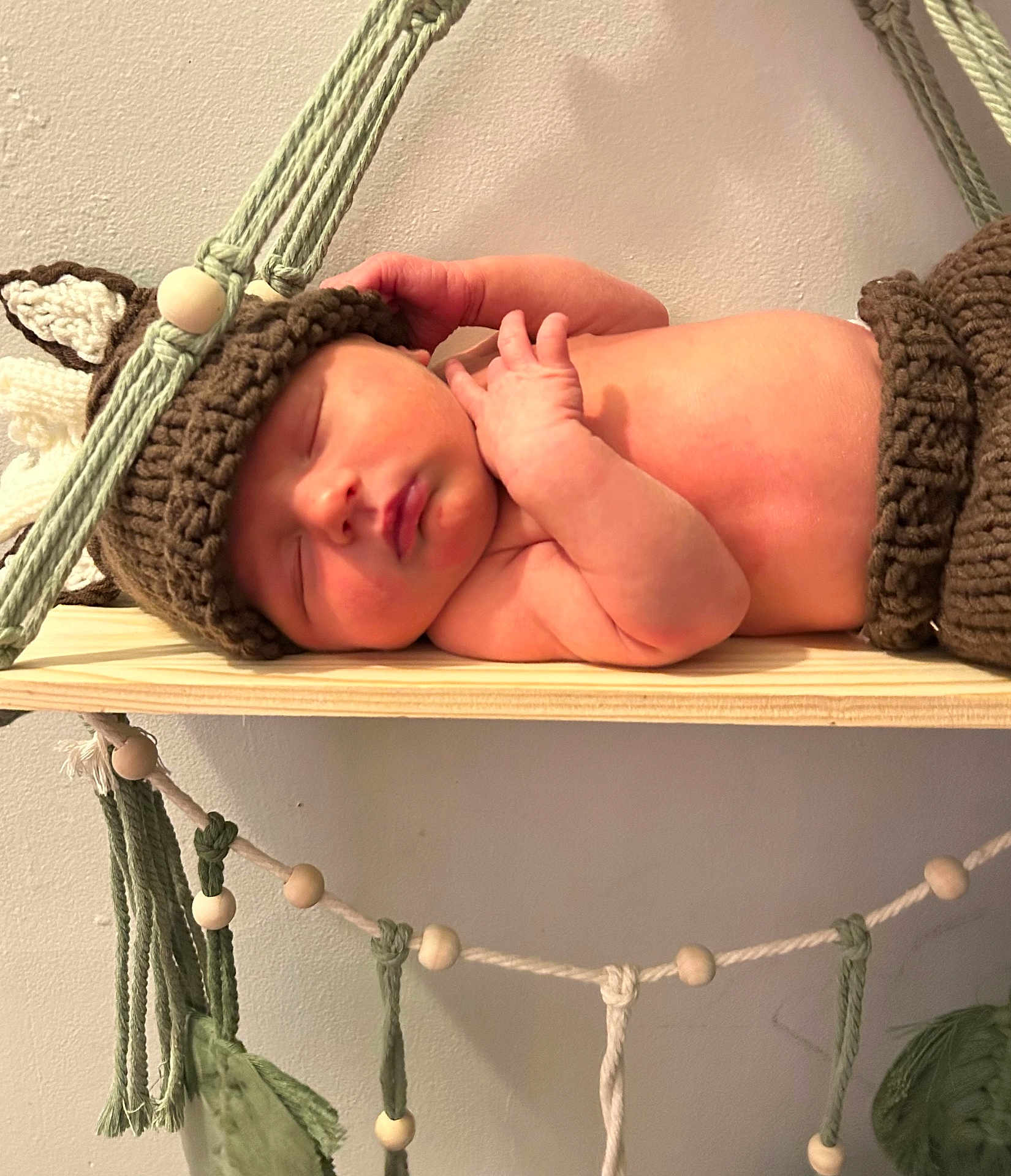 Jaxon joined the competition — help win amazing prizes! newborn, baby, sleeping, hat, knitted, wooden_swing, macrame, tassels, beads, cute, peaceful, infant, hand, skin, cuddle, rest, indoors, decor, soft, cozy