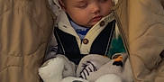 Jaxon joined the competition — help win amazing prizes! baby, sleeping, plush_toy, cow_toy, blanket, jacket, child, cute, cozy, infant, face, peaceful, warm, soft, comfort, hood, button, cuddly, portrait, rest
