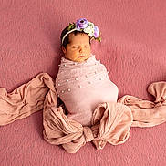 Olivia is registered to the contest to win money with this photo: newborn, baby, sleeping, pink, blanket, headband, flower, portrait, wrapped, bow, soft_texture, peaceful, infant, cute, cozy, closeup, child, studio, resting, adorable
