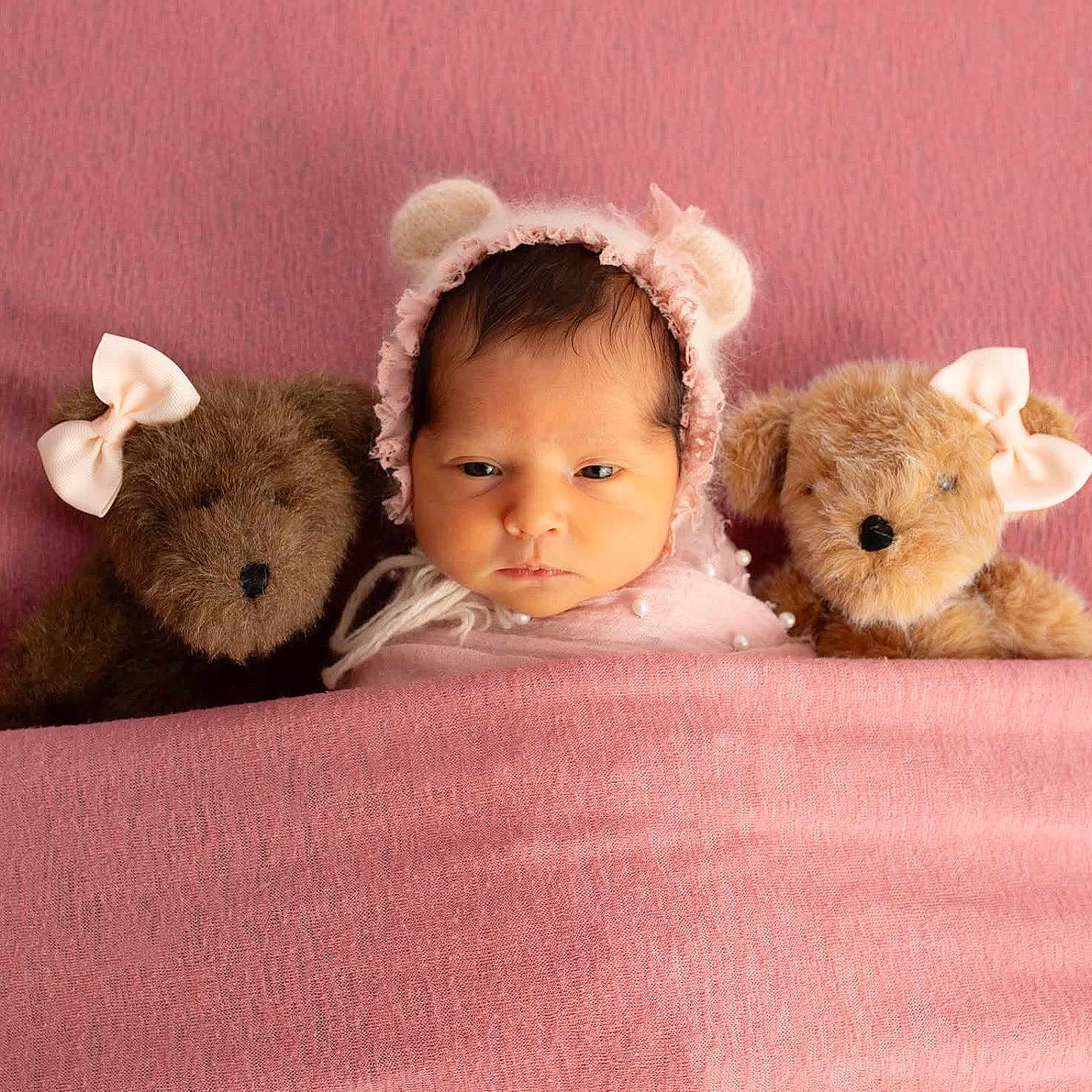 Olivia is registered to the contest to win money with this photo: baby, teddy_bear, blanket, pink, bonnet, bow, face, cute, soft, cozy, stuffed_animal, infant, portrait, child, sleeping, bed, comfort, toy, headwear, warm