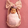 Olivia joined the competition — help win amazing prizes! newborn, baby, infant, pink, blanket, headband, flower, bow, sleeping, wrapped, portrait, soft, cute, peaceful, fabric, texture, closeup, child, adorable, studio