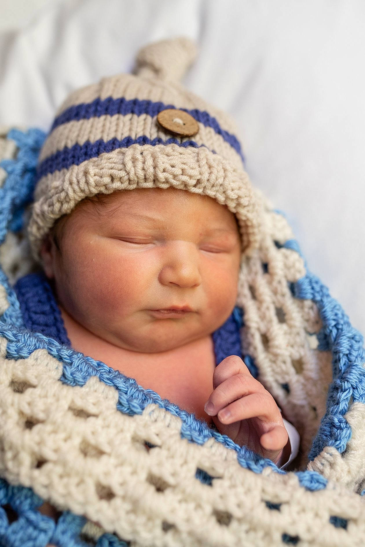 Sebastian joined the competition — help win amazing prizes! baby, beanie, bonnet, cap, cheek, child, close_up, crochet, headgear, headwear, knit_cap, knitting, outerwear, pattern, person, photograph, photography, skin, sleep, textile