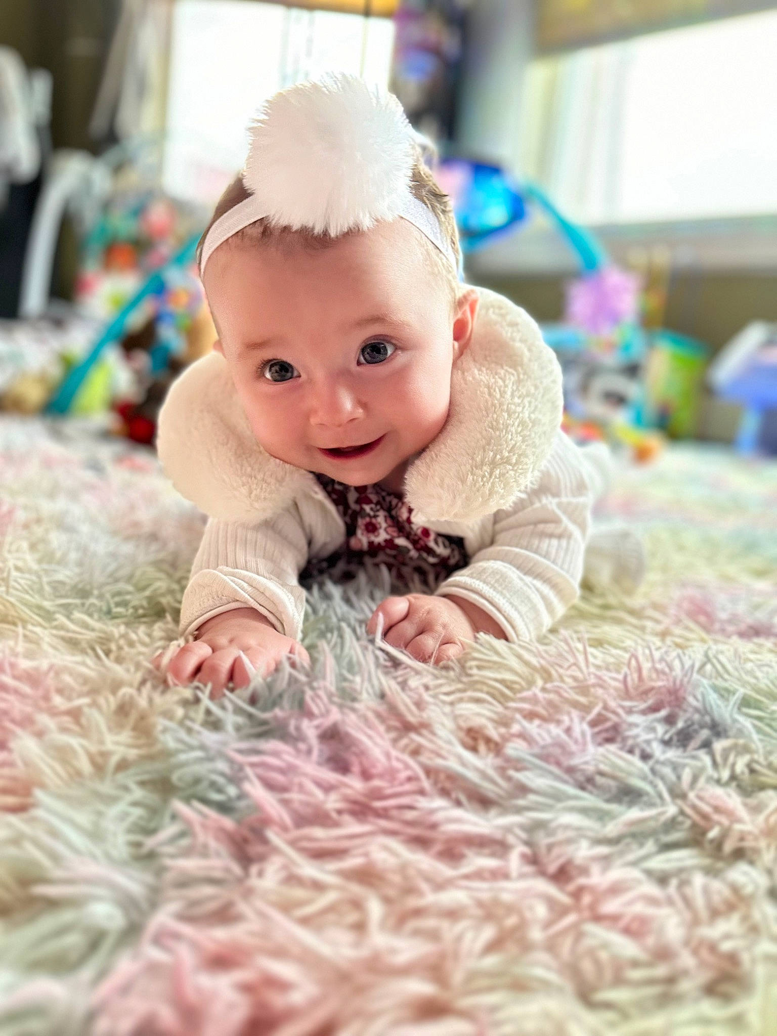 Ariel joined the competition — help win amazing prizes! baby, baby_toddler_clothing, baby_toys, child, doll, fashion_accessory, fawn, flooring, fur, happy, headpiece, linens, pattern, peach, person, pink, room, sitting, sweetness, toy
