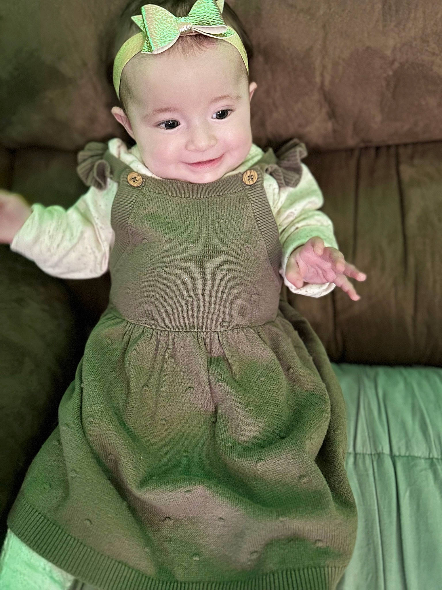 Ariel is registered to the contest to win money with this photo: baby, baby_products, baby_toddler_clothing, cap, child, day_dress, dress, face, head, headband, headwear, jewellery, joy, linens, one_piece_garment, pattern, person, pink, skin, sleeve