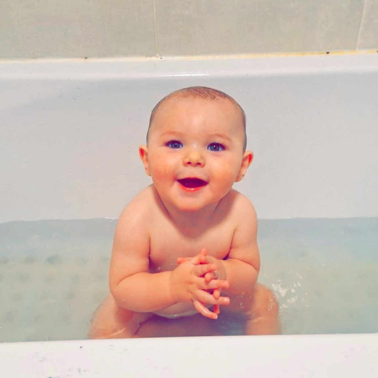 Leo joined the competition — help win amazing prizes! baby, bathing, bathtub, bodypart, face, happy, head, hottub, indoors, laughing, mouth, person, photography, portrait, sitting, smile, teeth, tub